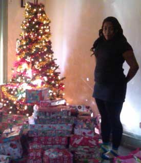 Mom Keisha with Critical Writing's gifts for the family