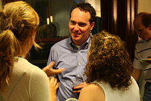 Tom Devaney chats with guests after his reading